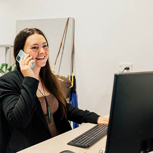 Image of a happy woman making phone contact